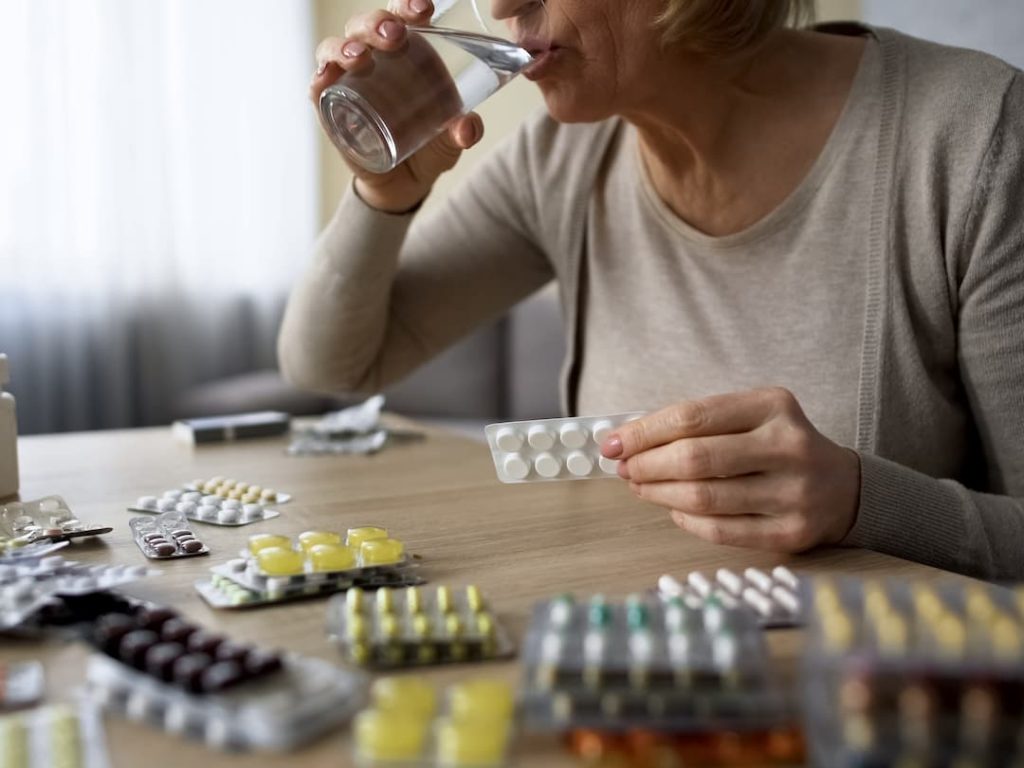 Elderly Lady Taking Her Medication