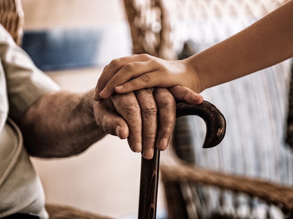 Holding An Elderly Mans Hand