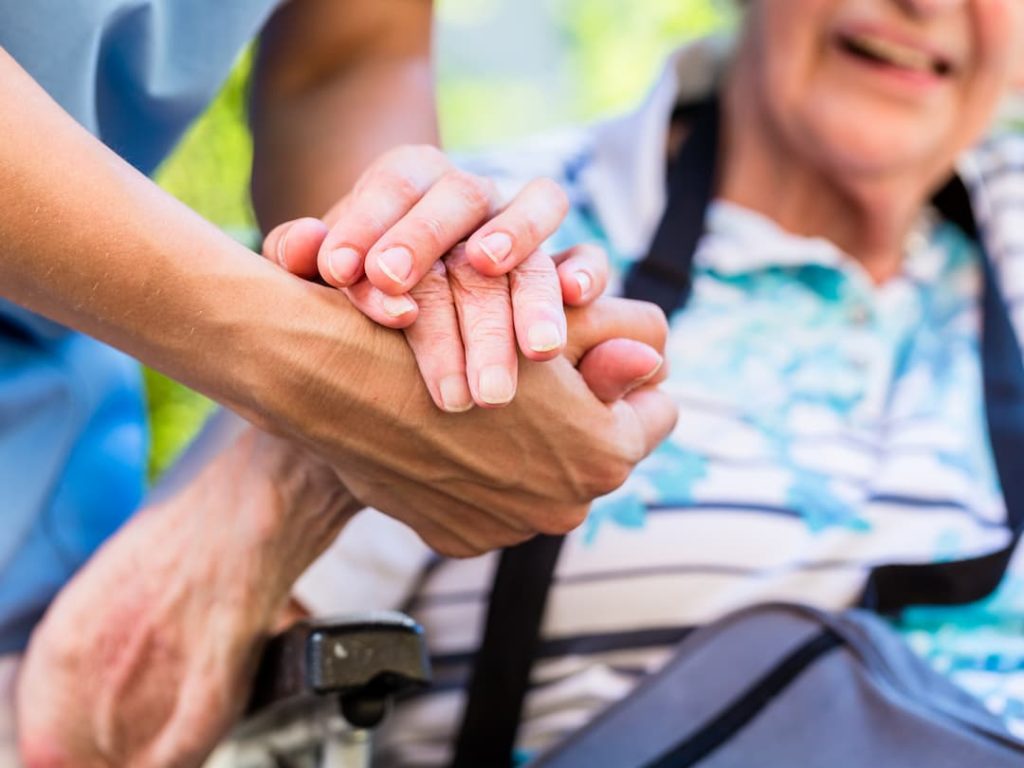 Nurse Holding A Patients Hand