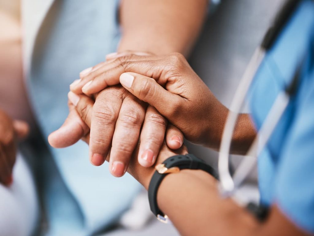 Nurse Holding A Patients Hand
